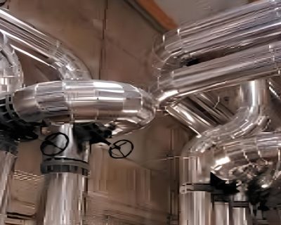 Comprendre le Matelas d&rsquo;Isolation Thermique Amovible : Pourquoi il Révolutionne le Calorifugeage Industriel face à la Tôle
